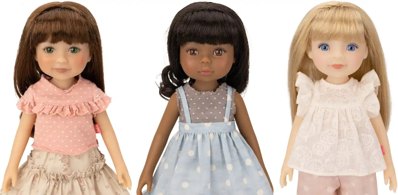 Three Jolli Buddies dolls with different hair colors and outfits on a white background