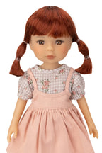 Jolli Buddies Dorothy Doll with red hair in pigtails wearing a checkered shirt and pink dress on a white background