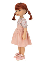 Jolli Buddies Dorothy Doll with red hair in pigtails wearing a pink dress on a white background