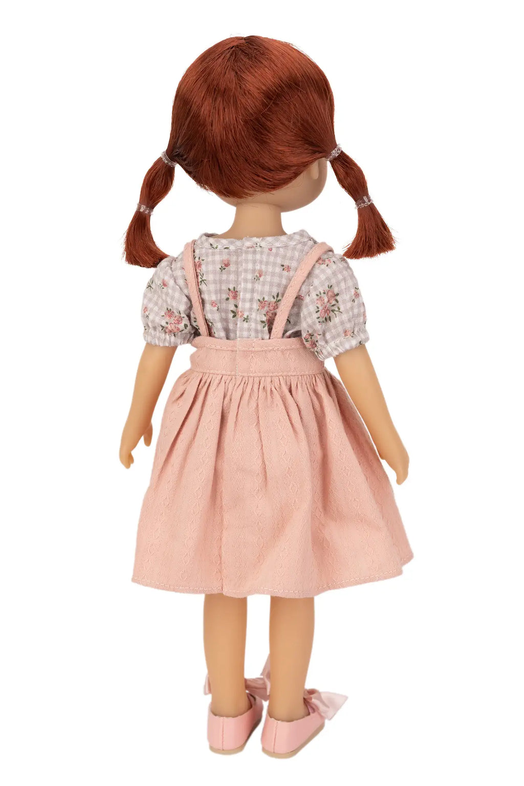 Jolli Buddies Dorothy Doll with red hair styled in pigtails wearing a pink dress and white blouse on a white background