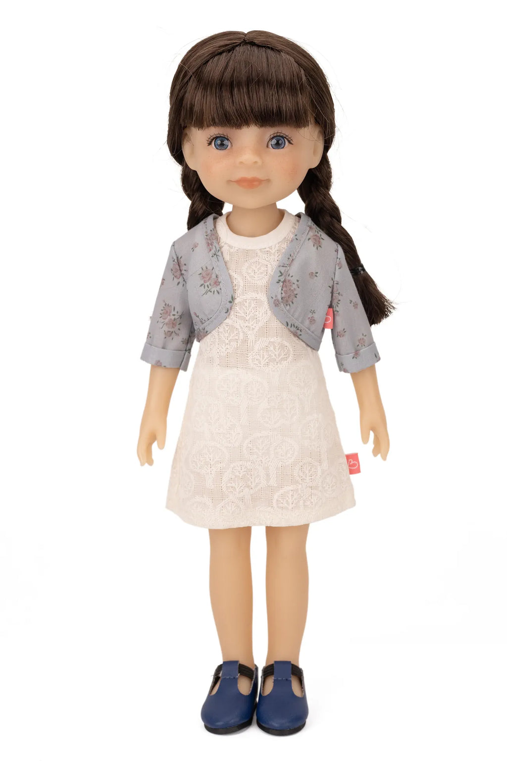 Jolli Buddies Iris Doll with a white dress and gray jacket on a white background