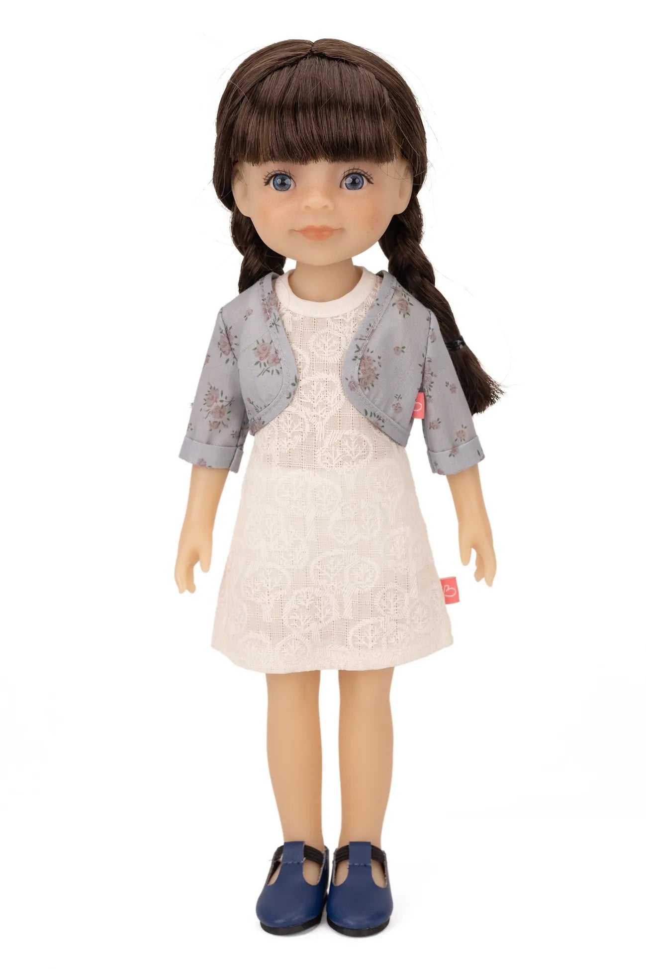 Jolli Buddies Iris Doll with a white dress and gray jacket on a white background