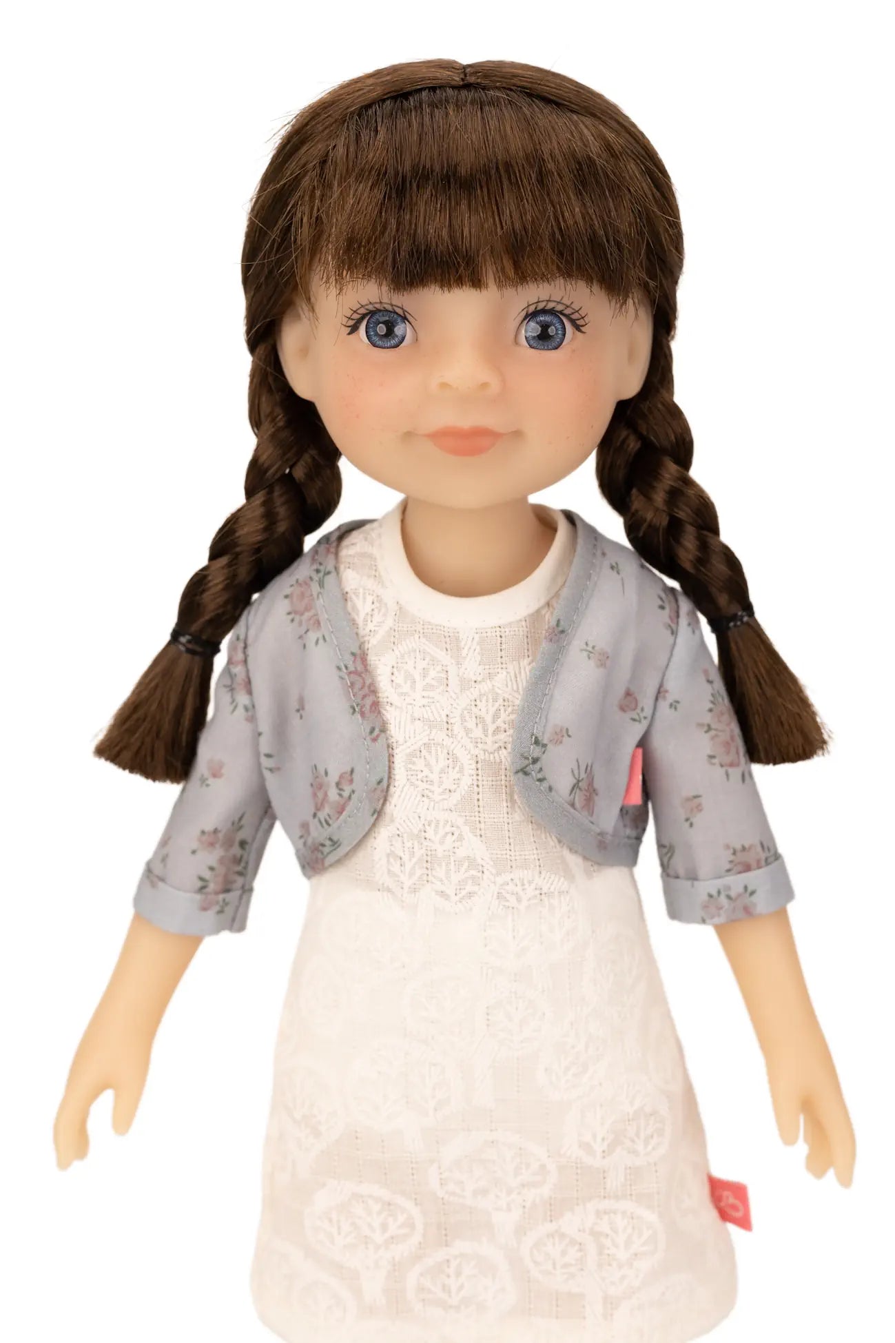 Jolli Buddies Iris Doll with braided hair wearing a white dress and gray cardigan on a white background