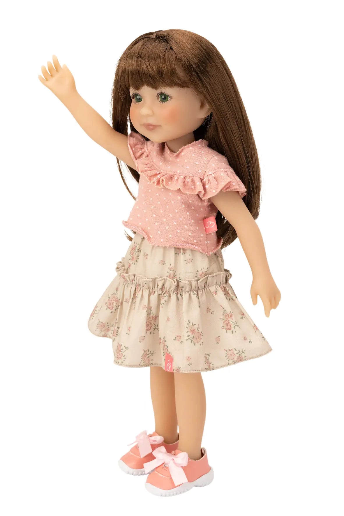 Jolli Buddies Joey Doll wearing a pink top and floral skirt on a white background