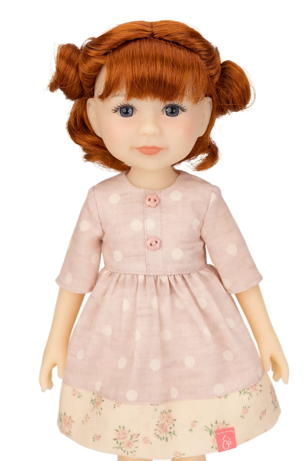 Jolli Buddies Leanne Doll with red hair wearing a pink dress with white polka dots on a white background