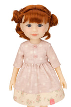 Jolli Buddies Leanne Doll with red hair wearing a pink dress with white polka dots on a white background
