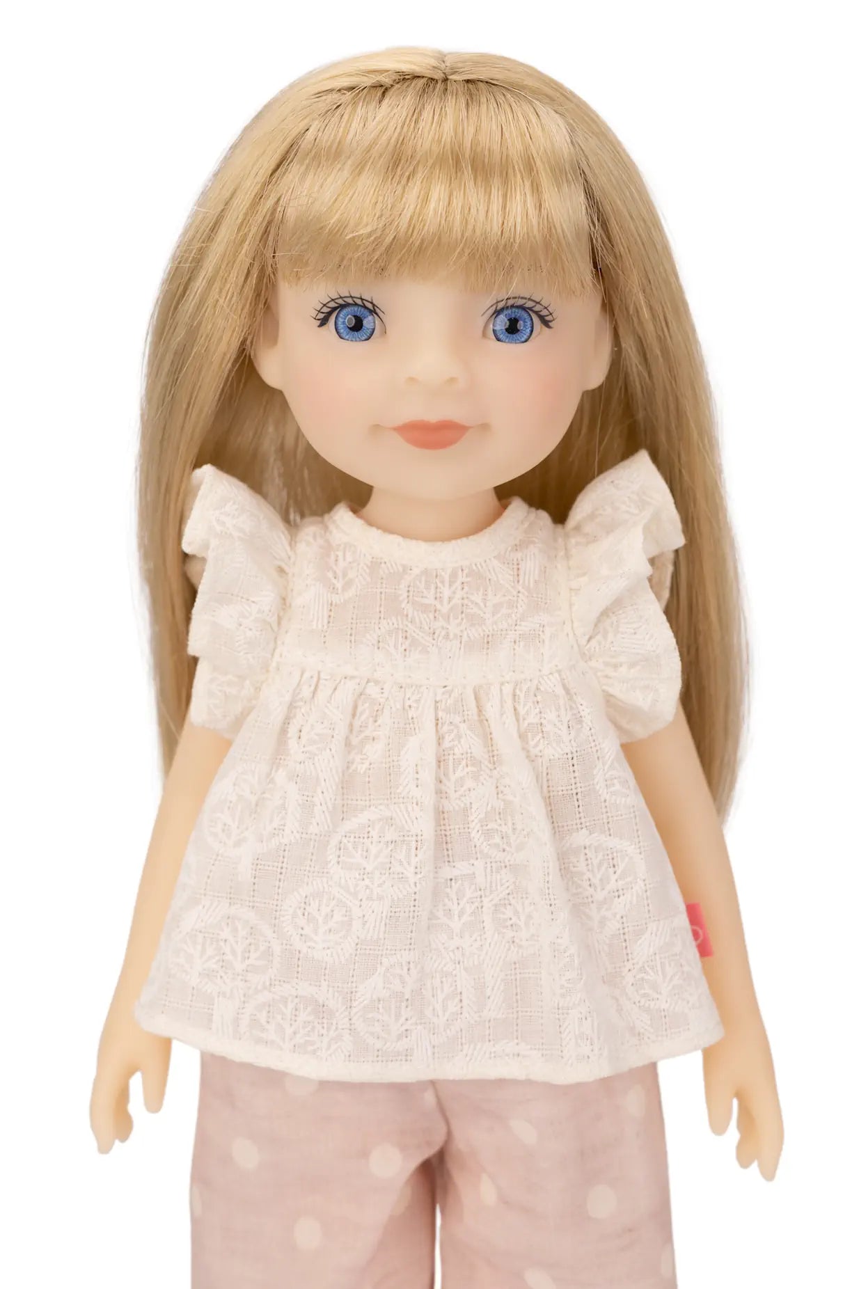 Jolli Buddies Lisa Doll with blonde hair and blue eyes wearing a white lace top and pink pants on a white background