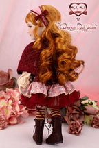 Doll with long red hair and a red outfit standing among flowers, with 'Ruby Red' and 'Wang's Doll House' branding.