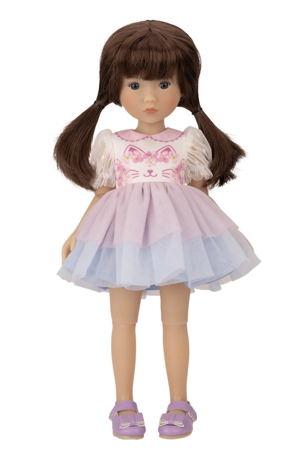 Doll with brown hair wearing a pink and white dress on a white background