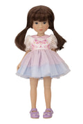 Doll with brown hair wearing a pink and white dress on a white background