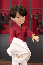 Doll in a red outfit with a white jacket against a red and black checkered background