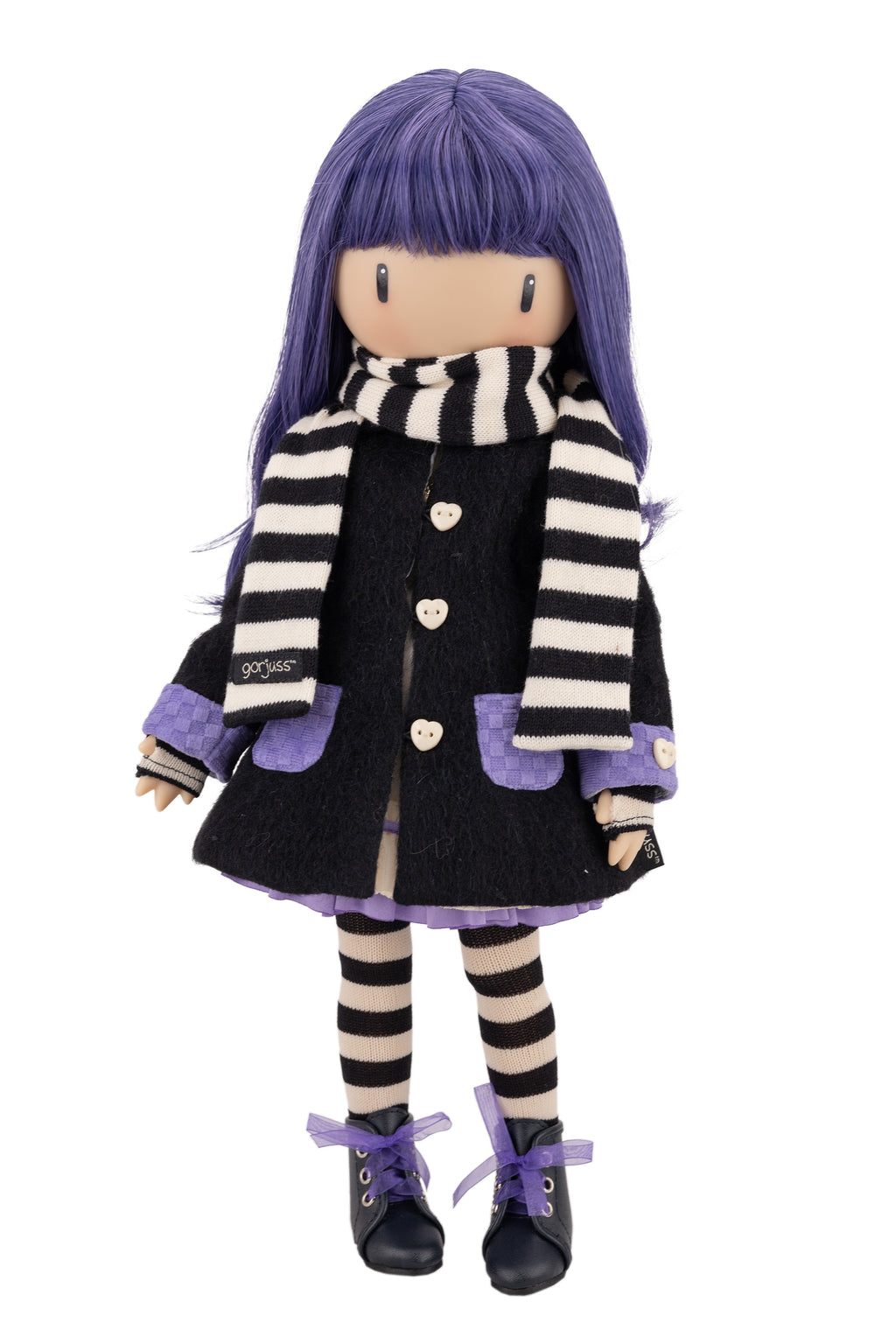 Doll with purple hair and striped scraf and black coat on a white background