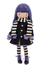 Doll with purple hair and striped scraf and black coat on a white background