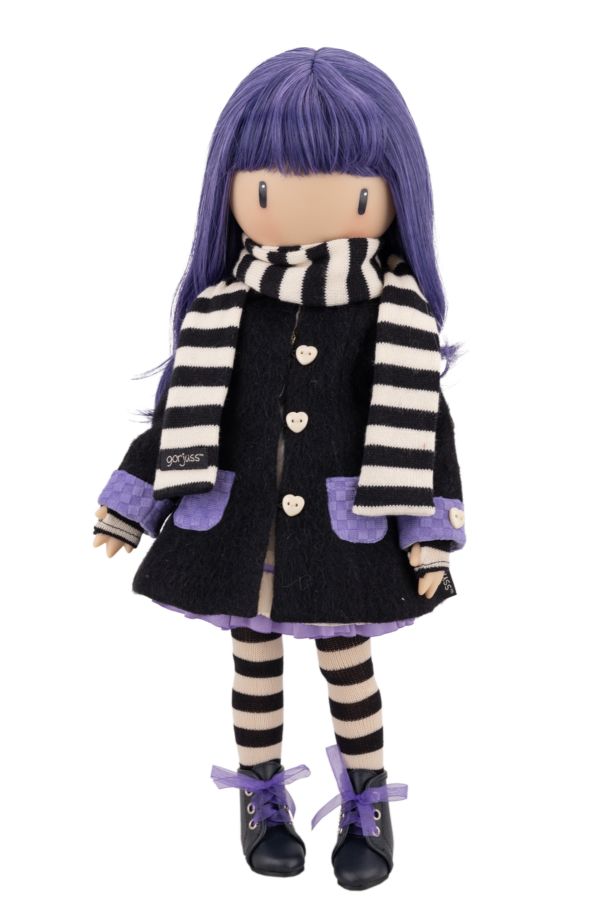 Doll with purple hair and striped scraf and black coat on a white background