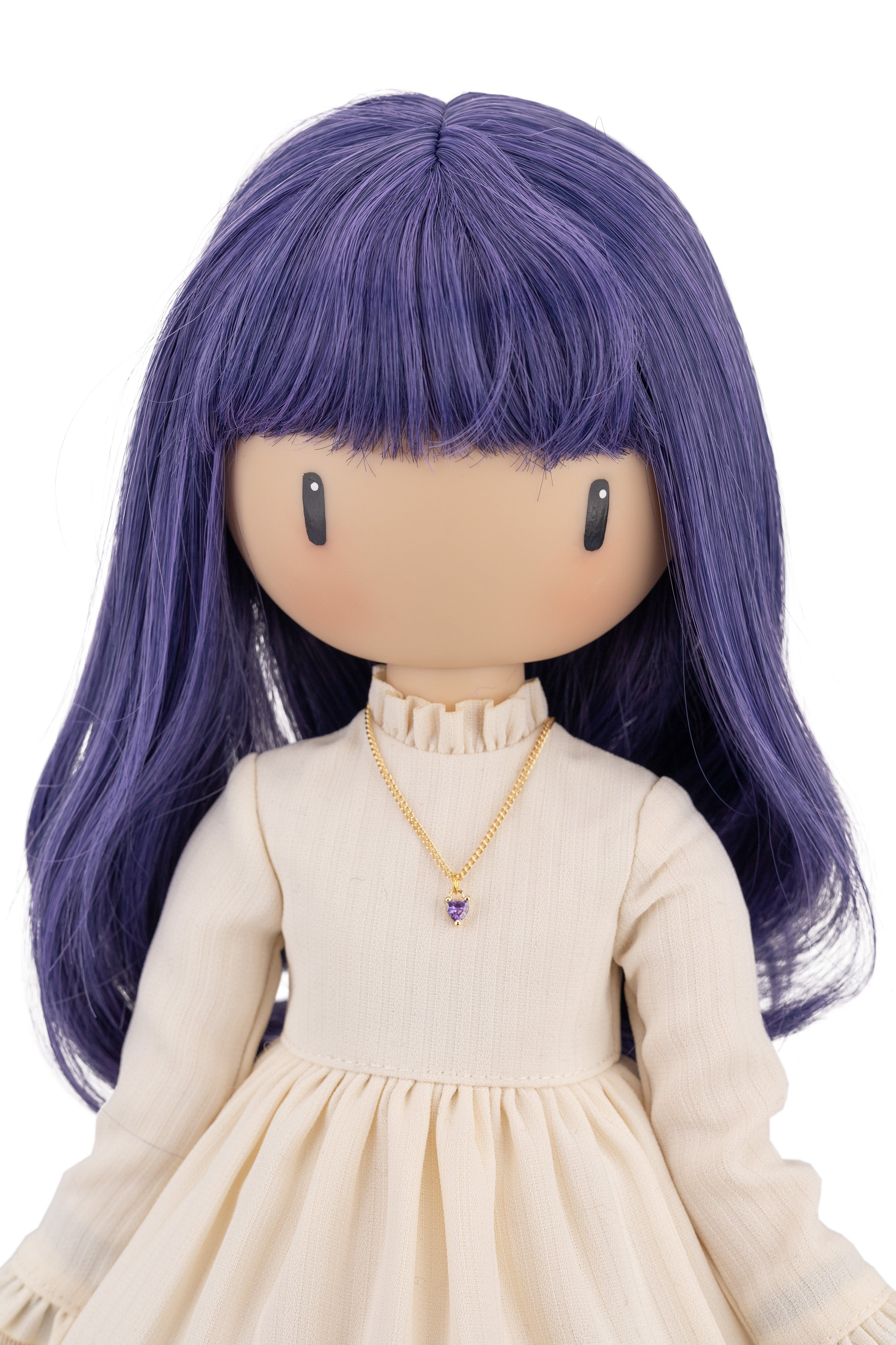 Doll with purple hair and a white dress on a white background
