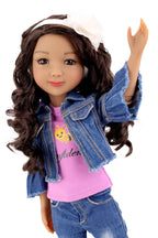 Doll wearing a denim jacket and purple shirt with a white background