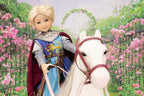 Lancelot doll in knight costume with white horse in garden setting