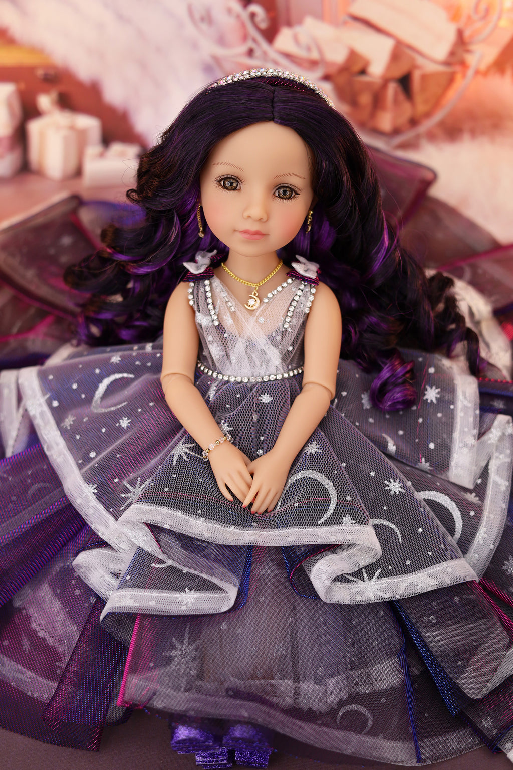 Doll with a gray dress with star patterns and purple hair in a decorative setting.