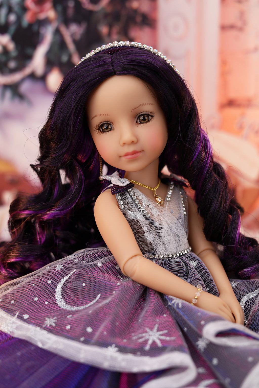 Doll with purple hair and dress in a decorative setting