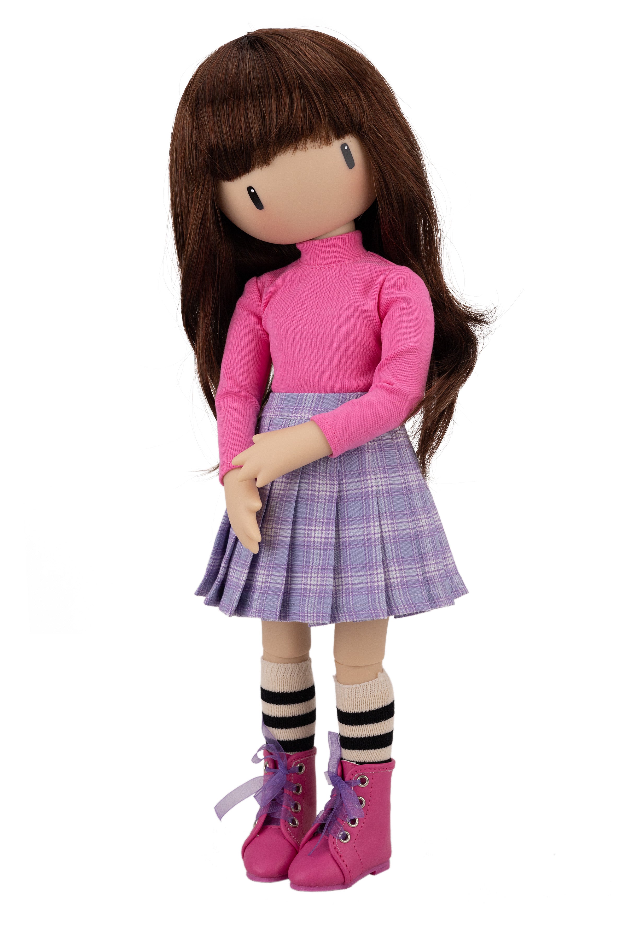 Doll wearing a pink sweater, plaid skirt, and pink boots on a white background