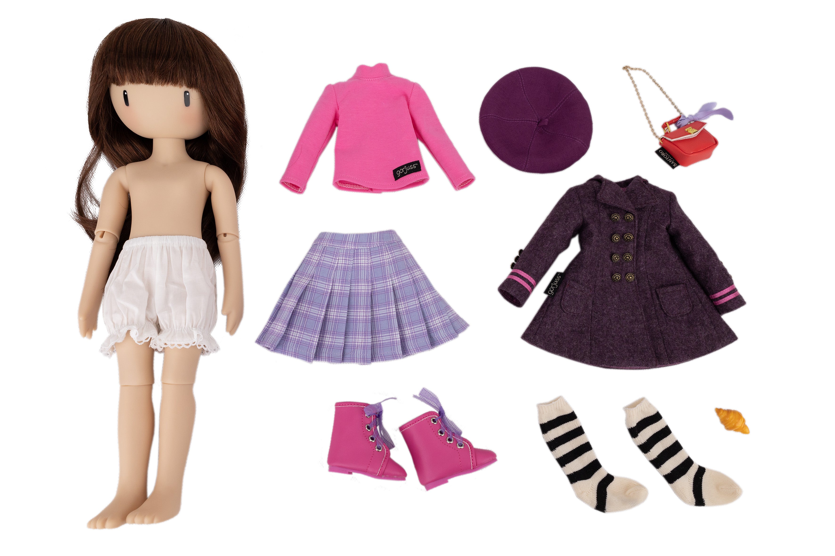Doll with a variety of clothing items on a white background