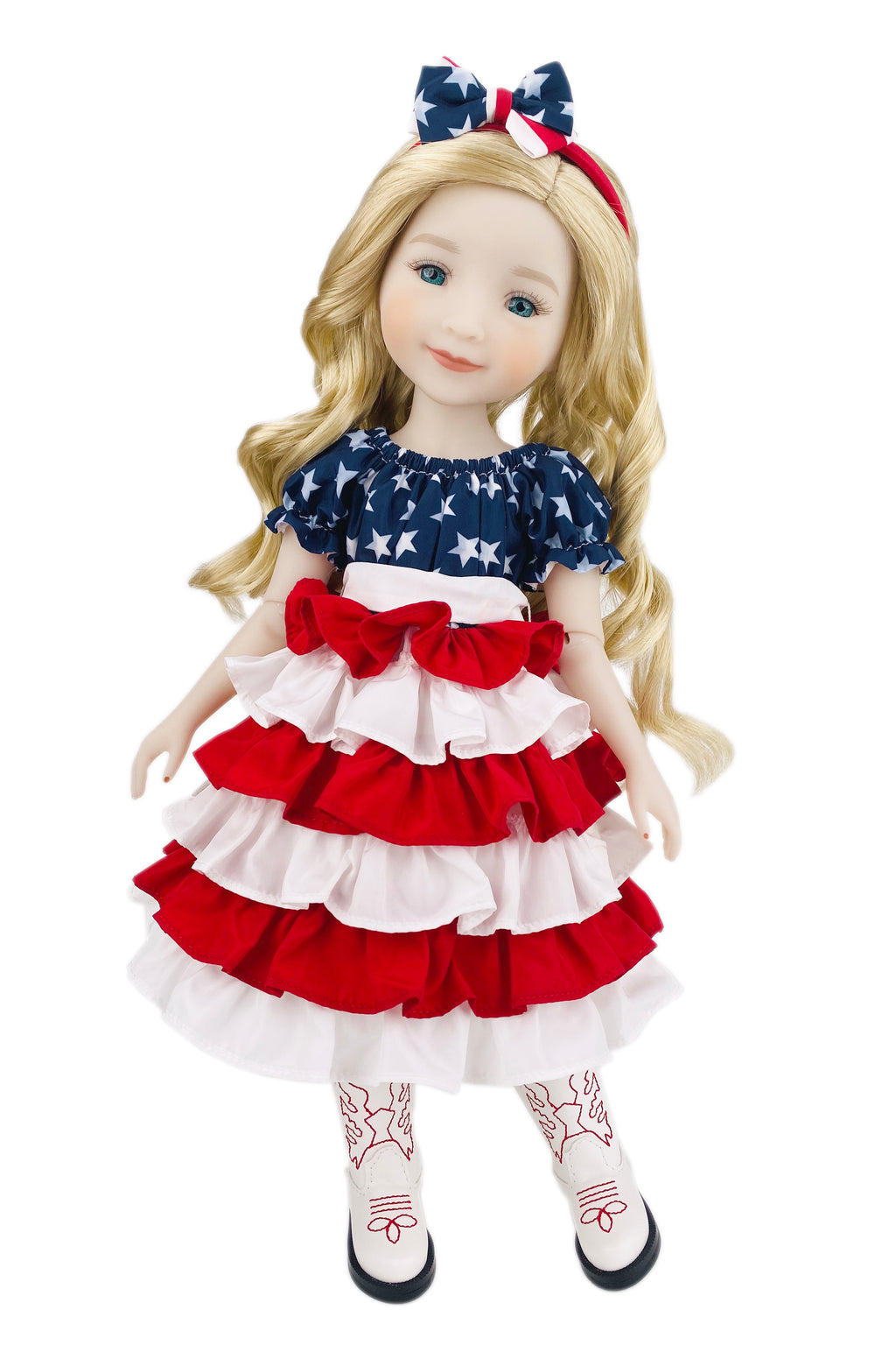 Doll wearing a red, white, and blue dress with a bow on a white background