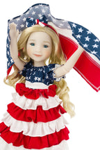 Doll wearing a patriotic dress with a matching headband, holding an American flag.