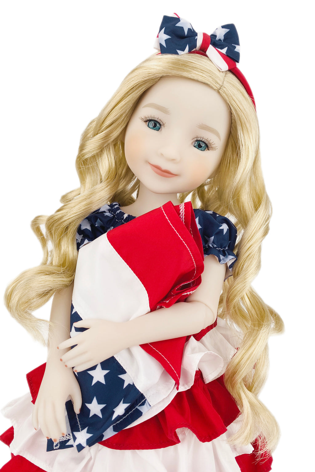 Doll with blonde hair wearing a patriotic outfit with red, white, and blue colors.