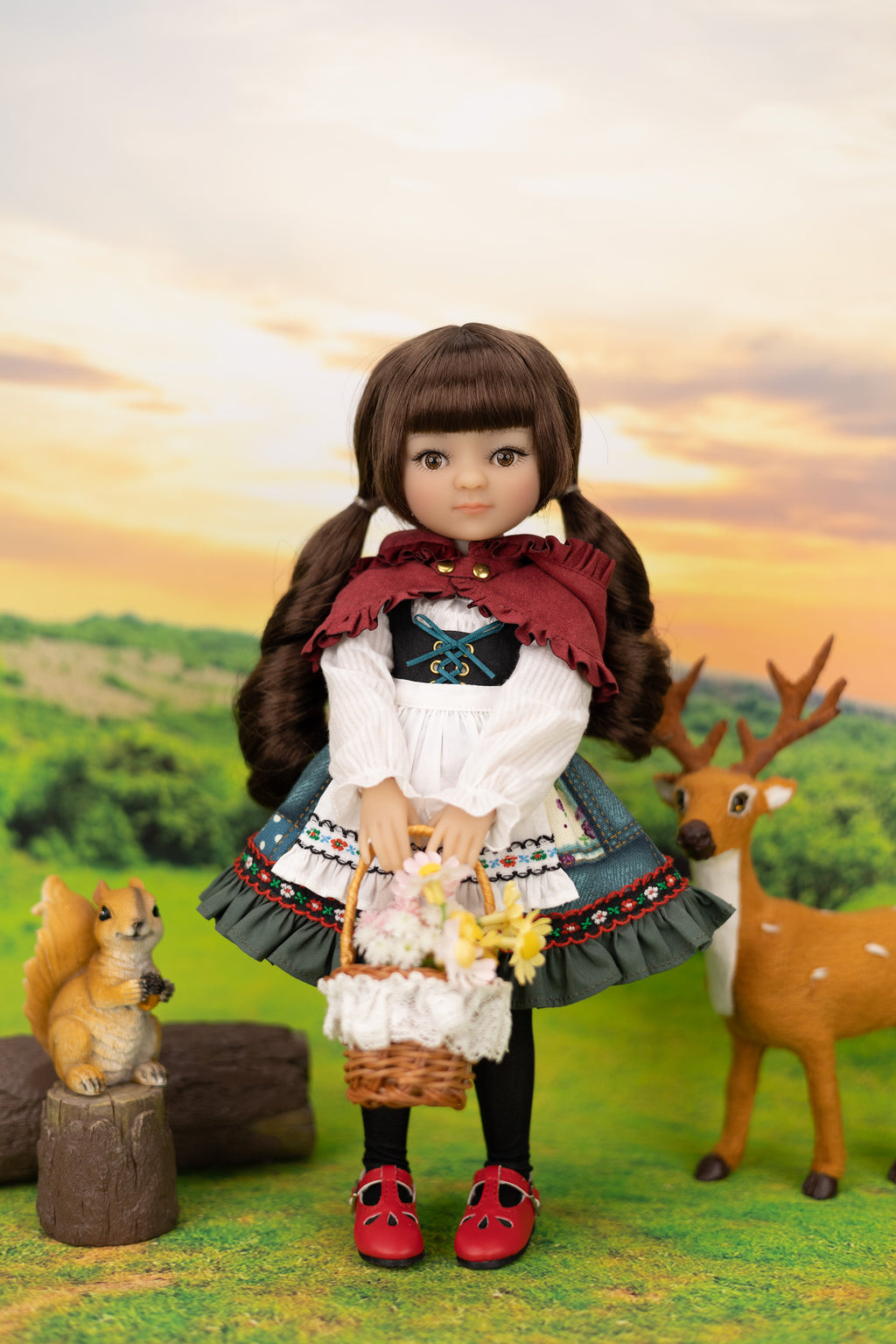 Doll with a scenic background featuring a deer and small animal.