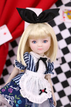 Doll with blonde hair and a black bow, wearing a blue and white outfit with a checkered background.