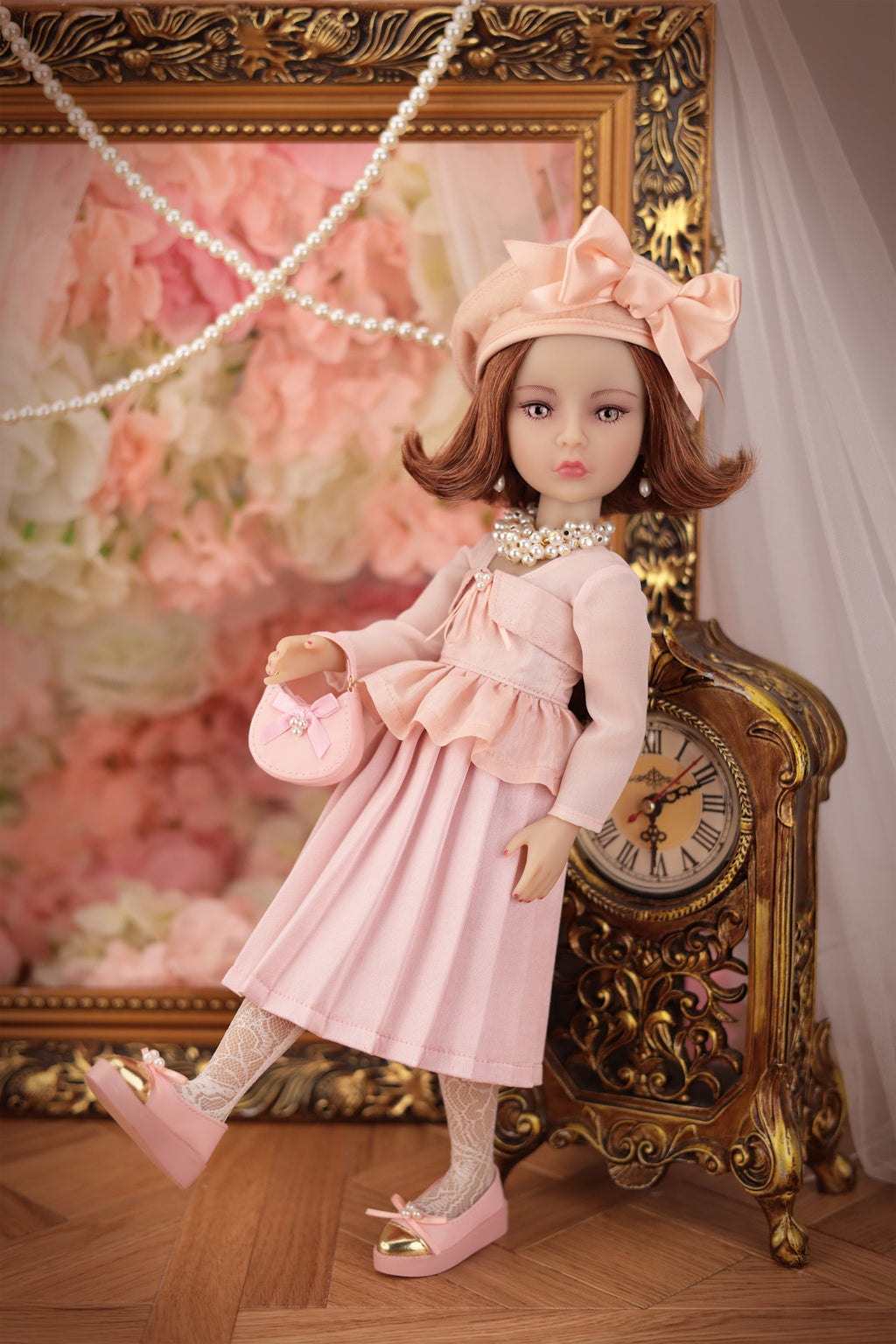 Lou in a pink dress with a decorative background