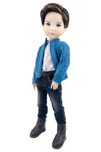 Doll wearing a blue knitted cardigan, striped shirt, jeans, and black boots on a white background