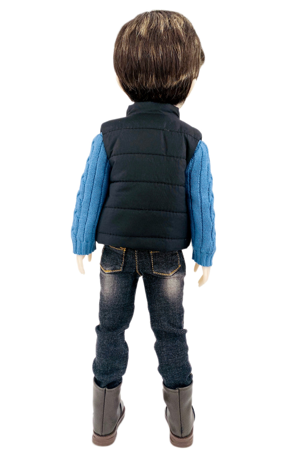 Back view of a doll wearing a black puffer vest, blue shirt, jeans, and brown boots on a white background.
