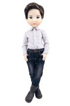 Doll wearing a striped shirt and jeans on a white background