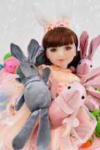 Doll with bunny ears surrounded by plush toys on a light background