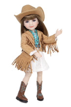 Doll wearing a cowboy outfit with a hat, jacket, boots, and scarf on a white background