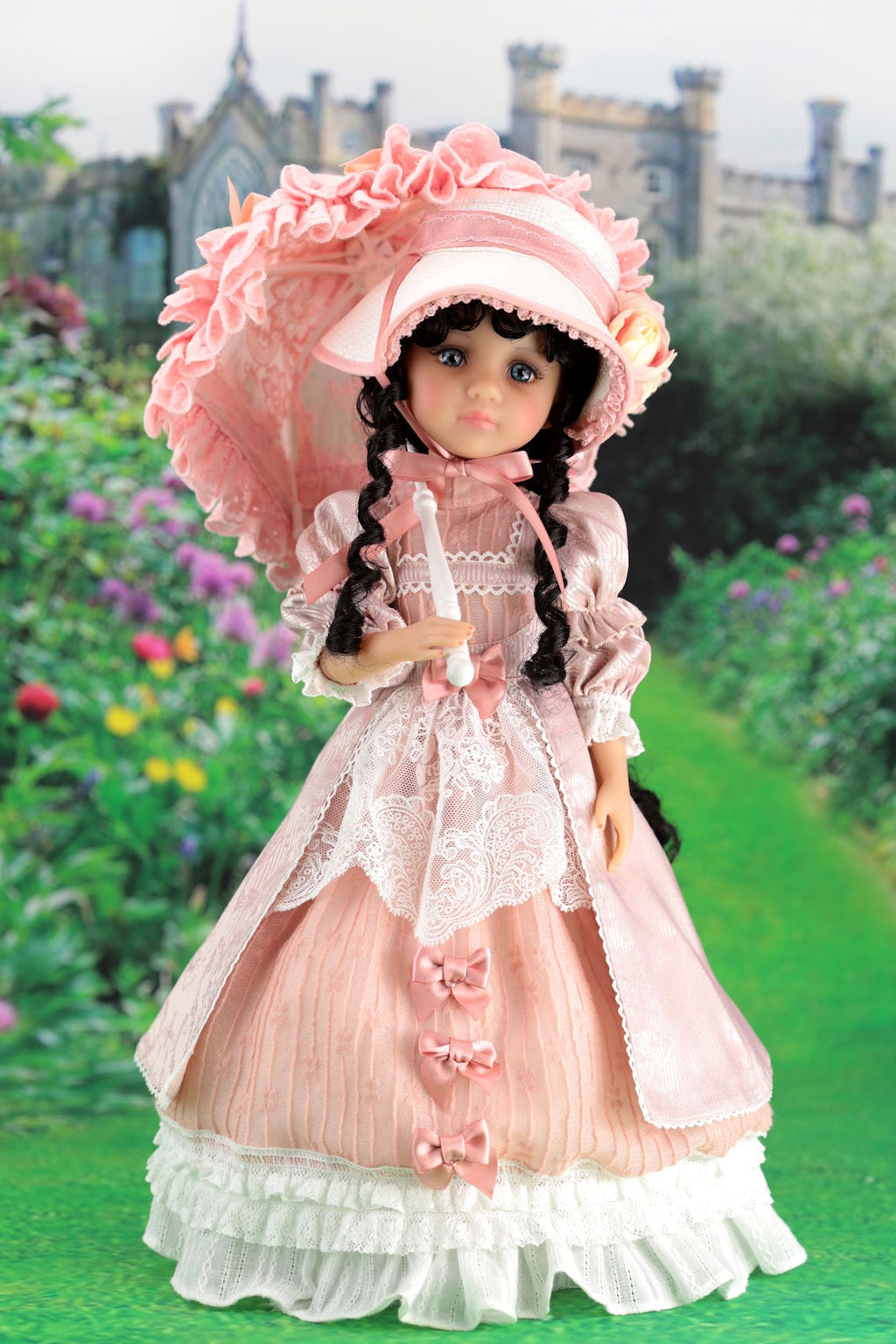 Doll in a pink historical dress with bonnet against a garden backdrop