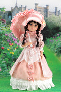 Doll in a pink historical dress with bonnet against a garden backdrop