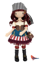 A stylized pirate Gorjuss doll with a black-and-white striped hat, burgundy hair, a cream blouse, brown vest, blue skirt panel, red-and-white striped skirt, black boots, and a small brown purse. A small red-and-blue bird figurine appears at the lower right on a plain white background.