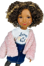 Doll wearing a pink jacket, white shirt with 'always be kind' text, and blue jeans on a white background