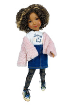 Doll wearing a pink fluffy jacket, denim skirt, and white shirt with text on a white background