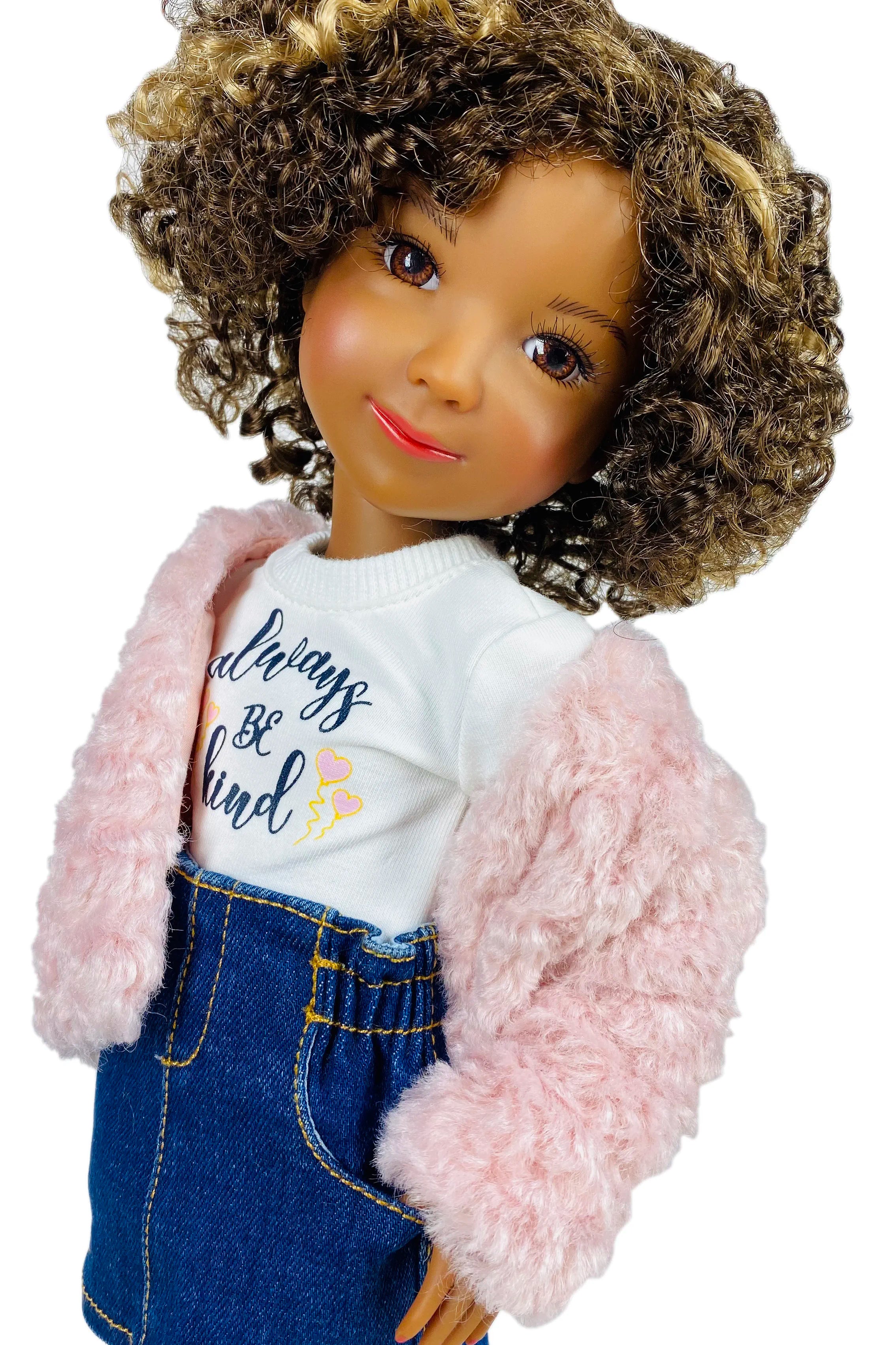 Doll wearing a pink jacket, white shirt with text, and blue jeans on a white background
