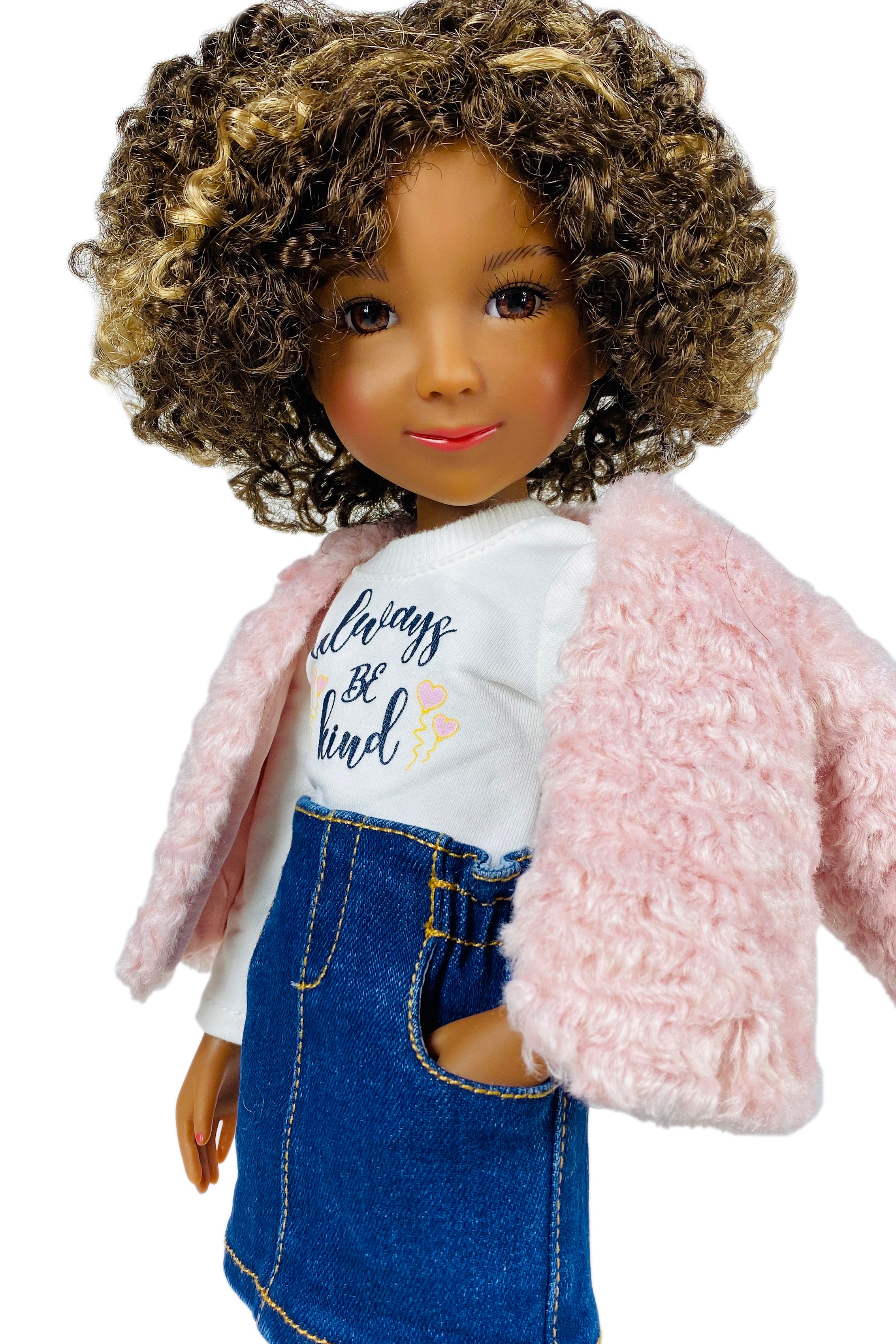 Doll wearing a pink jacket, white shirt with text, and blue denim skirt on a white background