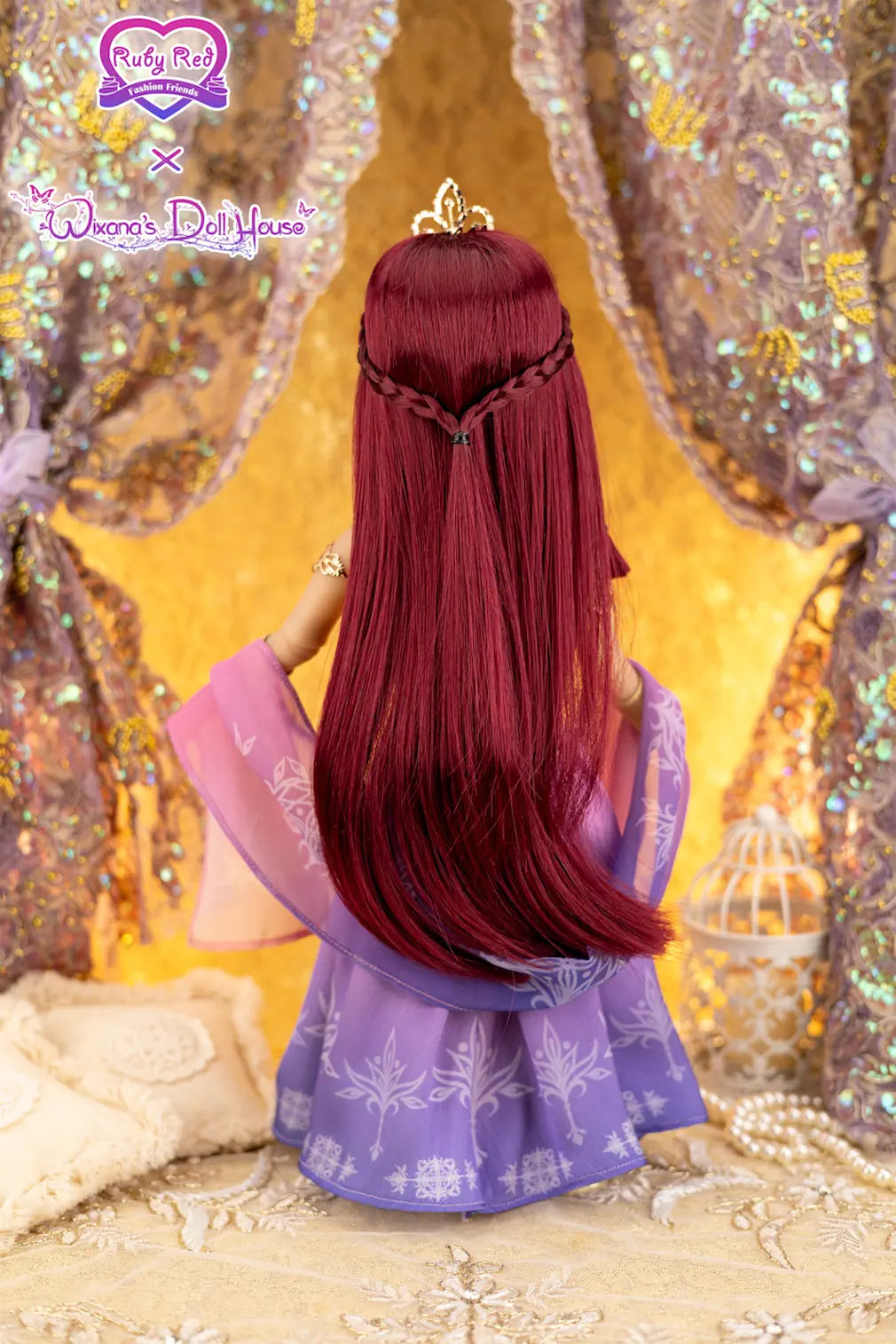Doll with long red hair and a purple dress in front of a decorative background