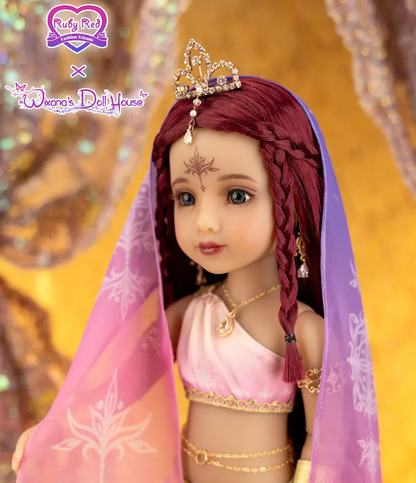 Doll with red hair and traditional outfit against a blurred background
