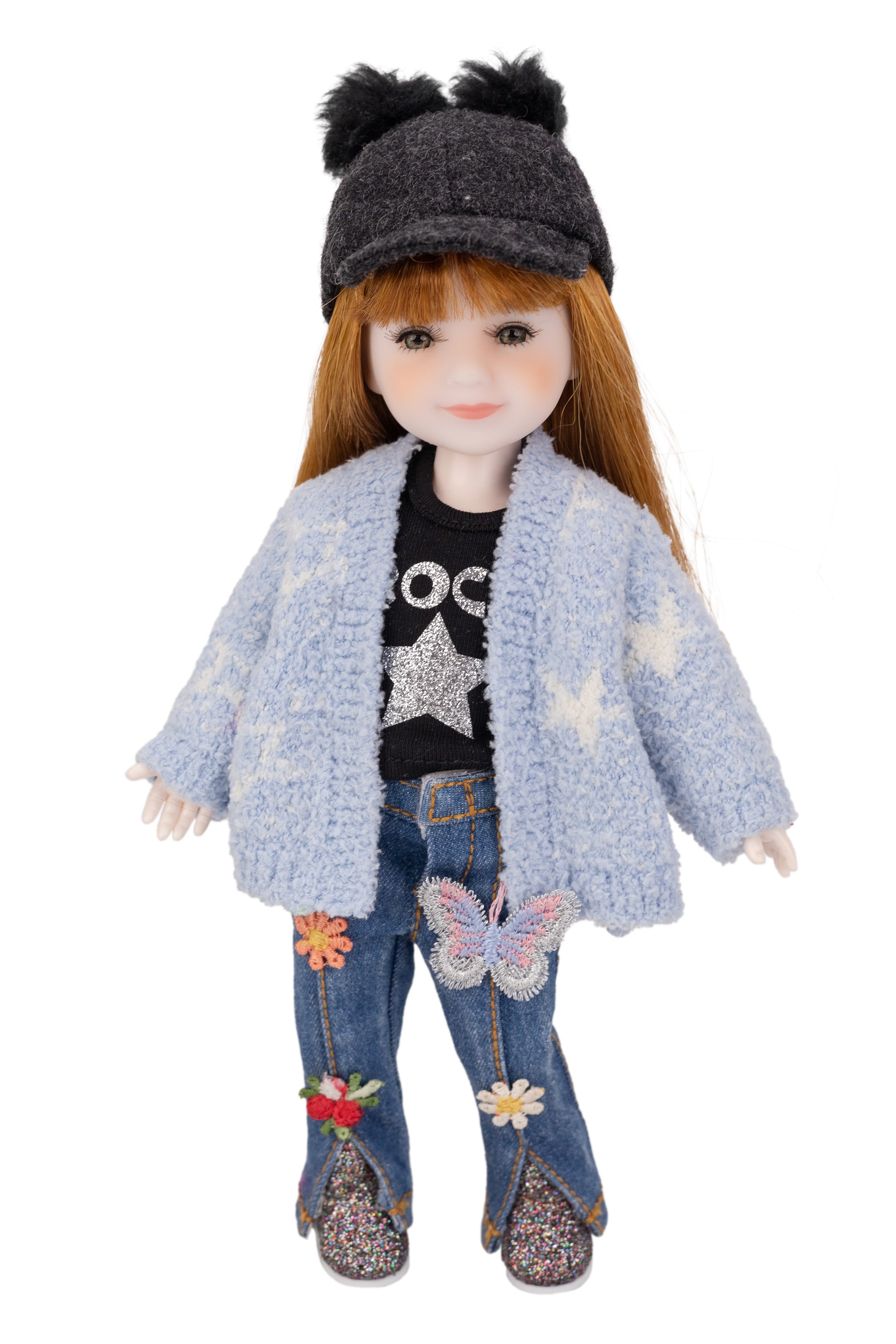 mini Stella doll wearing a blue textured jacket, black top with star design, and jeans with floral patches on a white background.