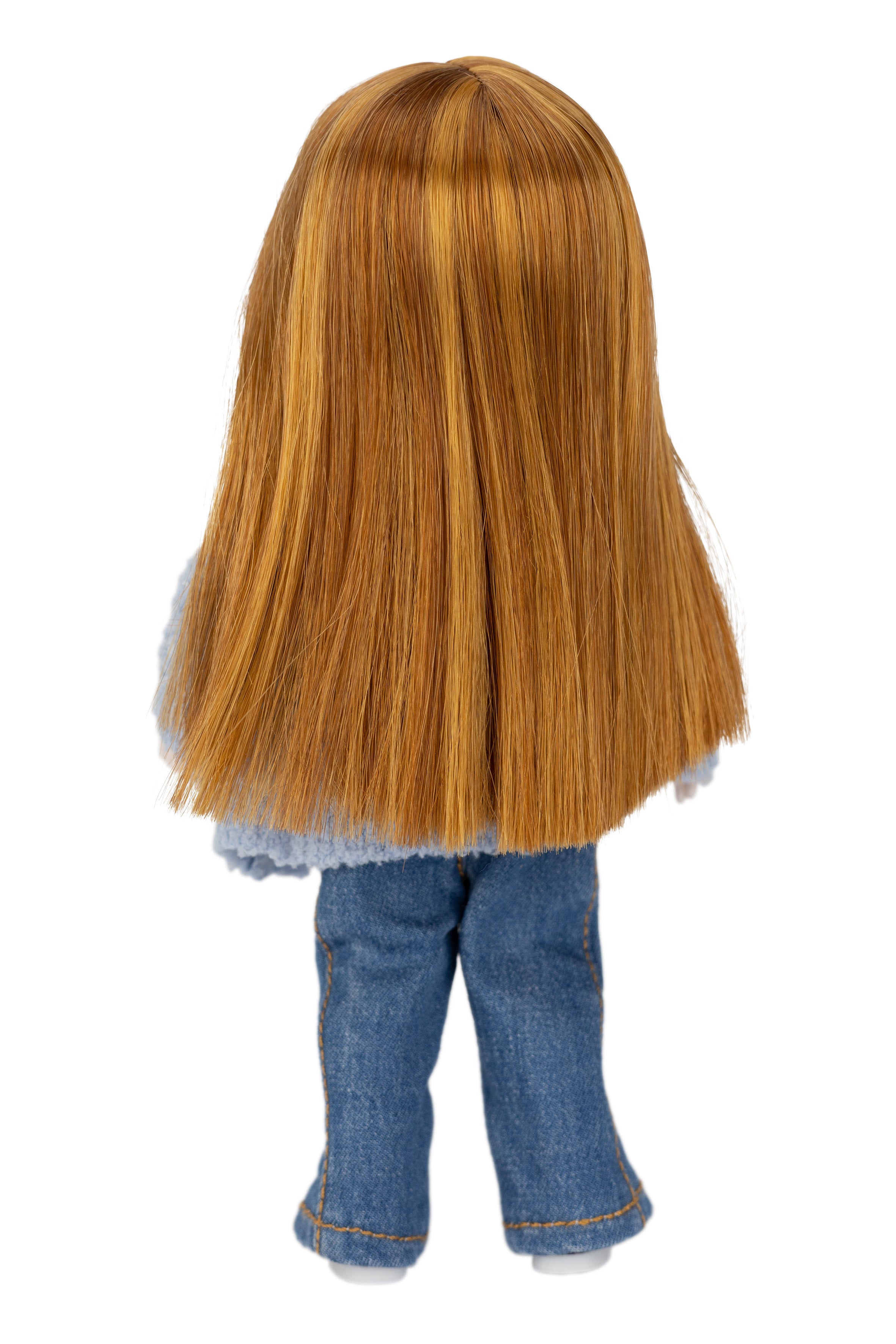 mini Stella doll with long red hair and blue jeans on a white background