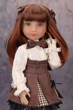 Doll with long brown hair wearing a brown and white outfit against a gray background