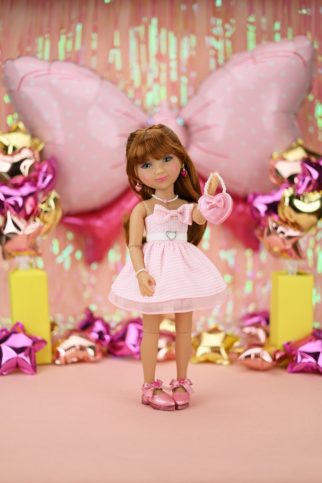 Doll in a pink dress with decorations in the background