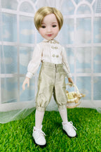 Doll wearing a white shirt with buttons and beige pants, standing on grass with a white lattice background.